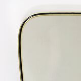 Elegant wall mirror in brass and black from the mid-century, Italy, 1950s.