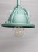 Workshop suspension with metallic green pole