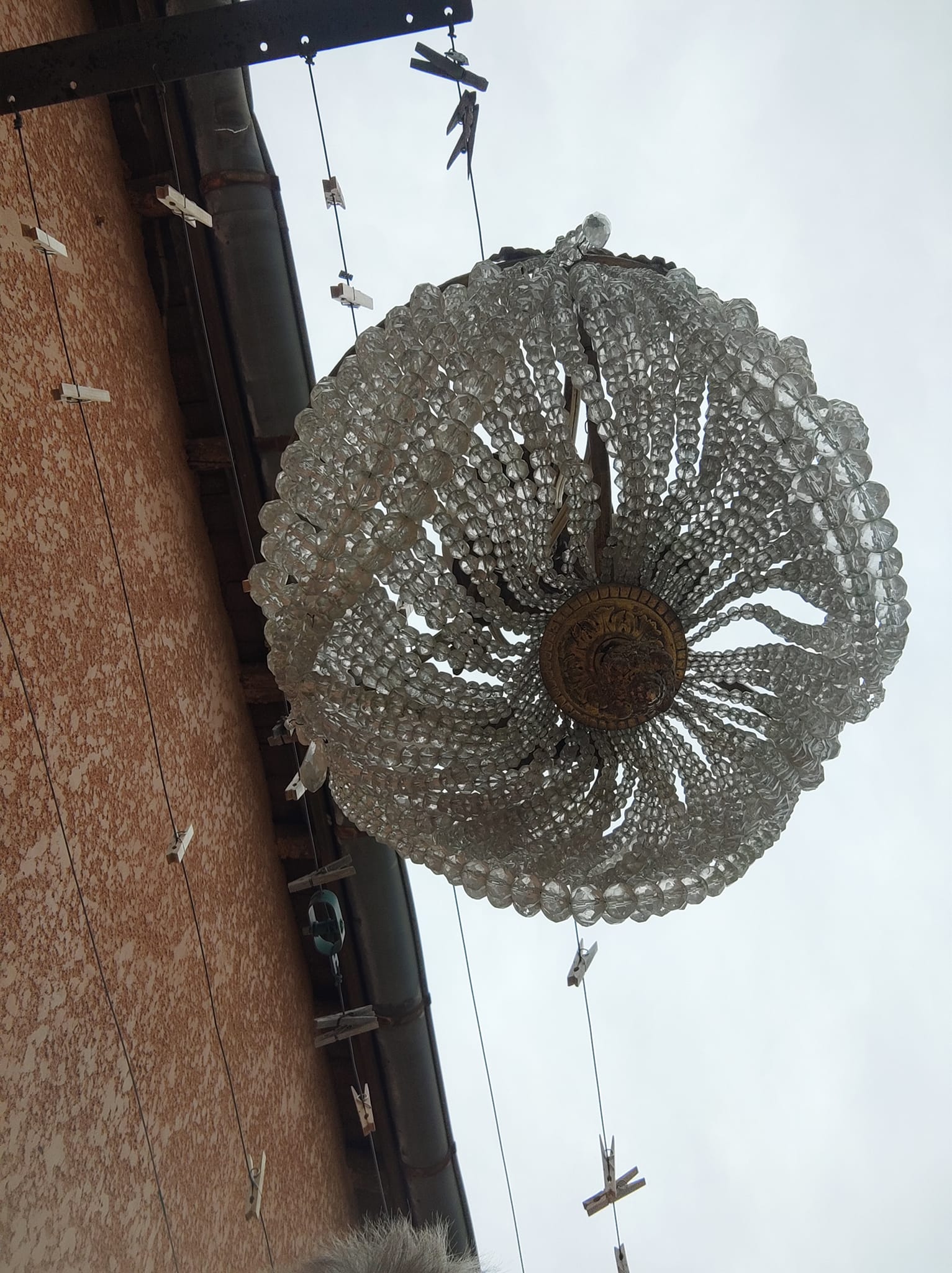 Antique bronze and crystal chandelier, formerly gas-powered, dating from the late 19th century.