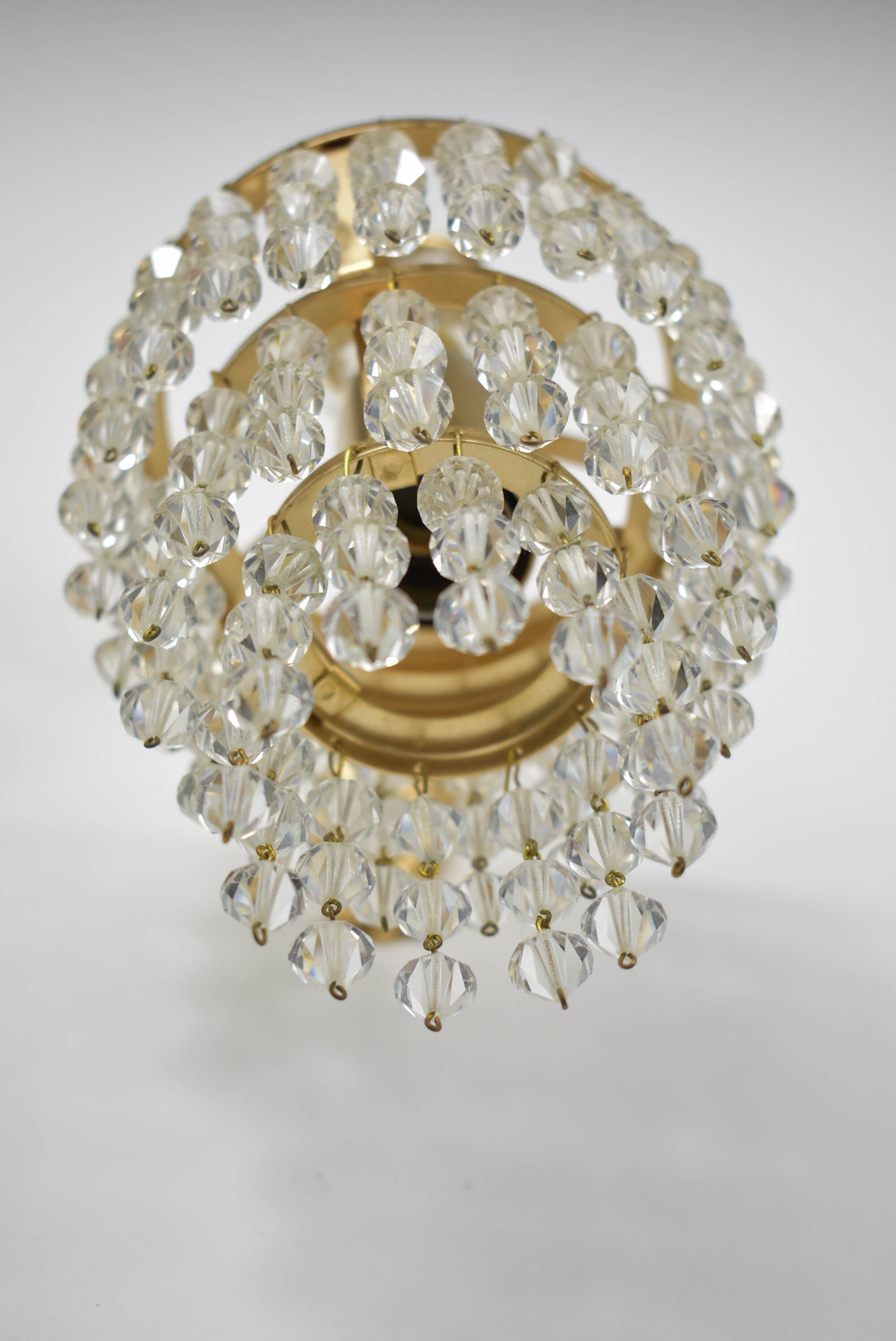 Pair of gold wall light with stamps