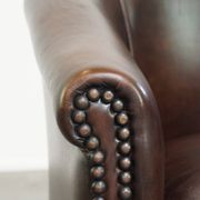 luxury dark leather club chair with English-style ball feet