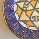 Decorative plate in glazed earthenware HB Quimper with ethnic patterns.