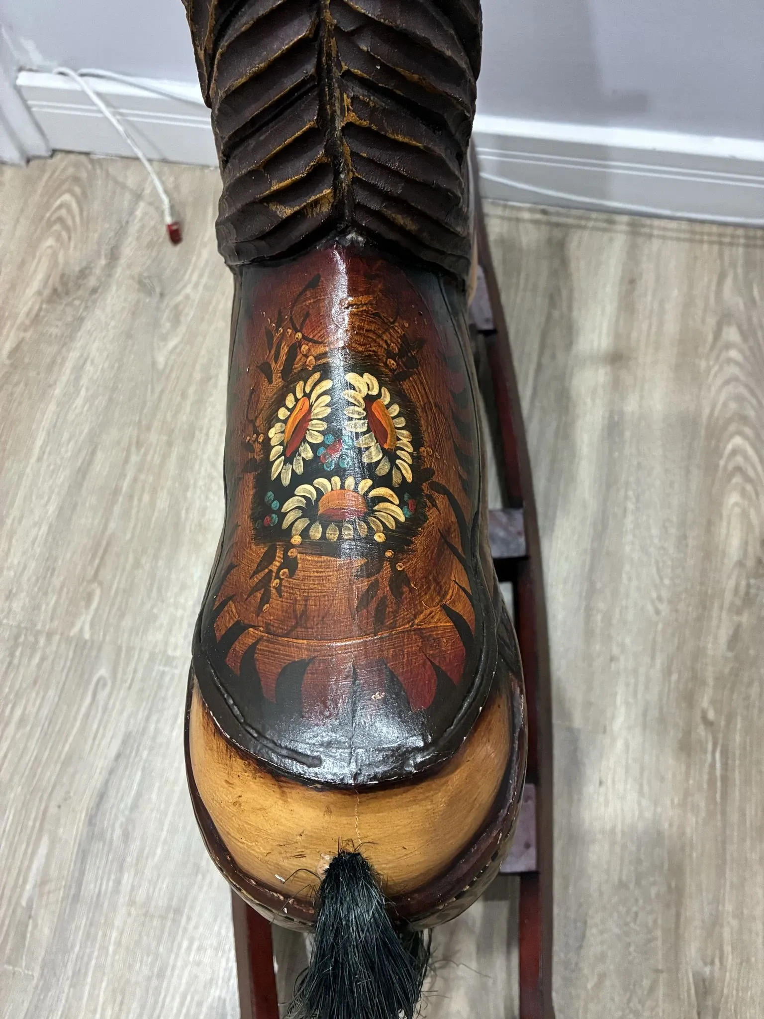 Antique hand-carved rocking horse on wheels, early 20th century