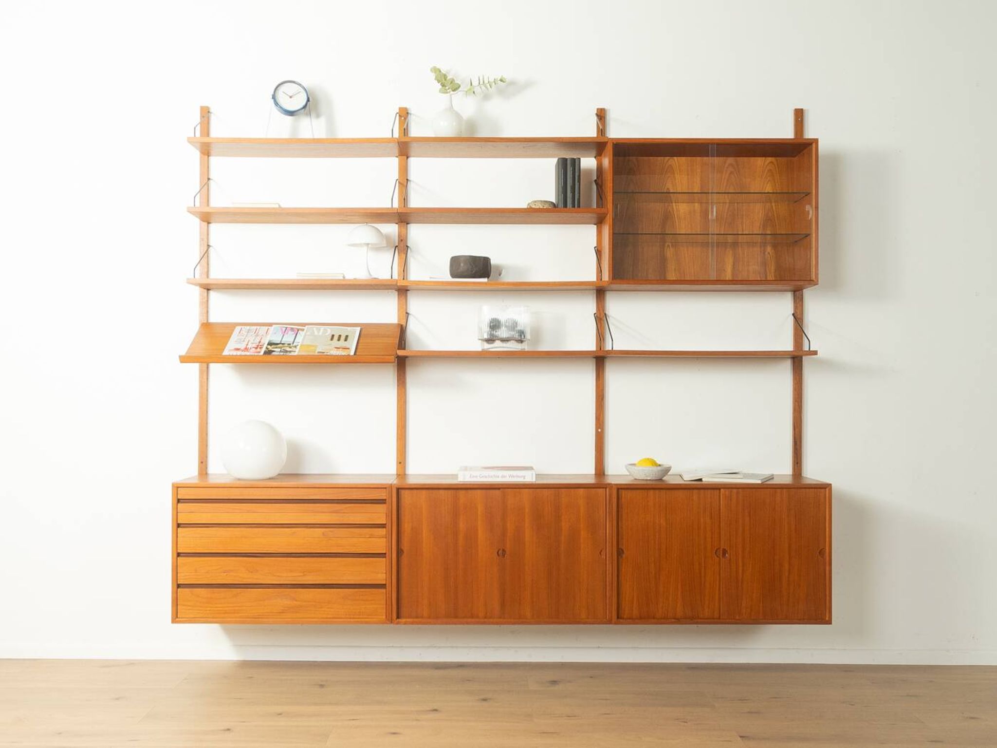 Classic shelving system from the 1960s in teak veneer by Poul Cadovius for Cado