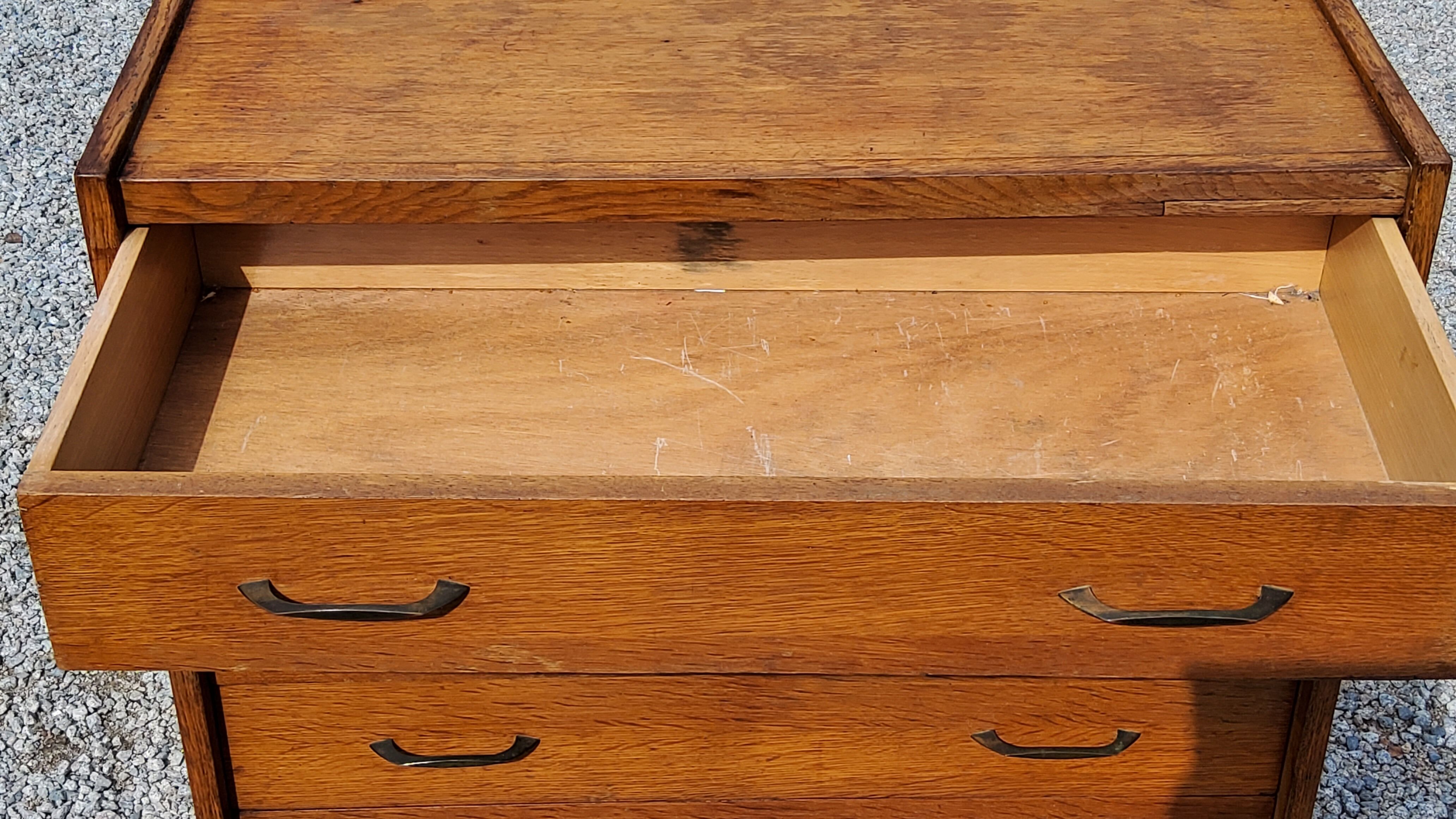 Chest of drawers of the 50s in golden blond oak 5 drawers conical feet