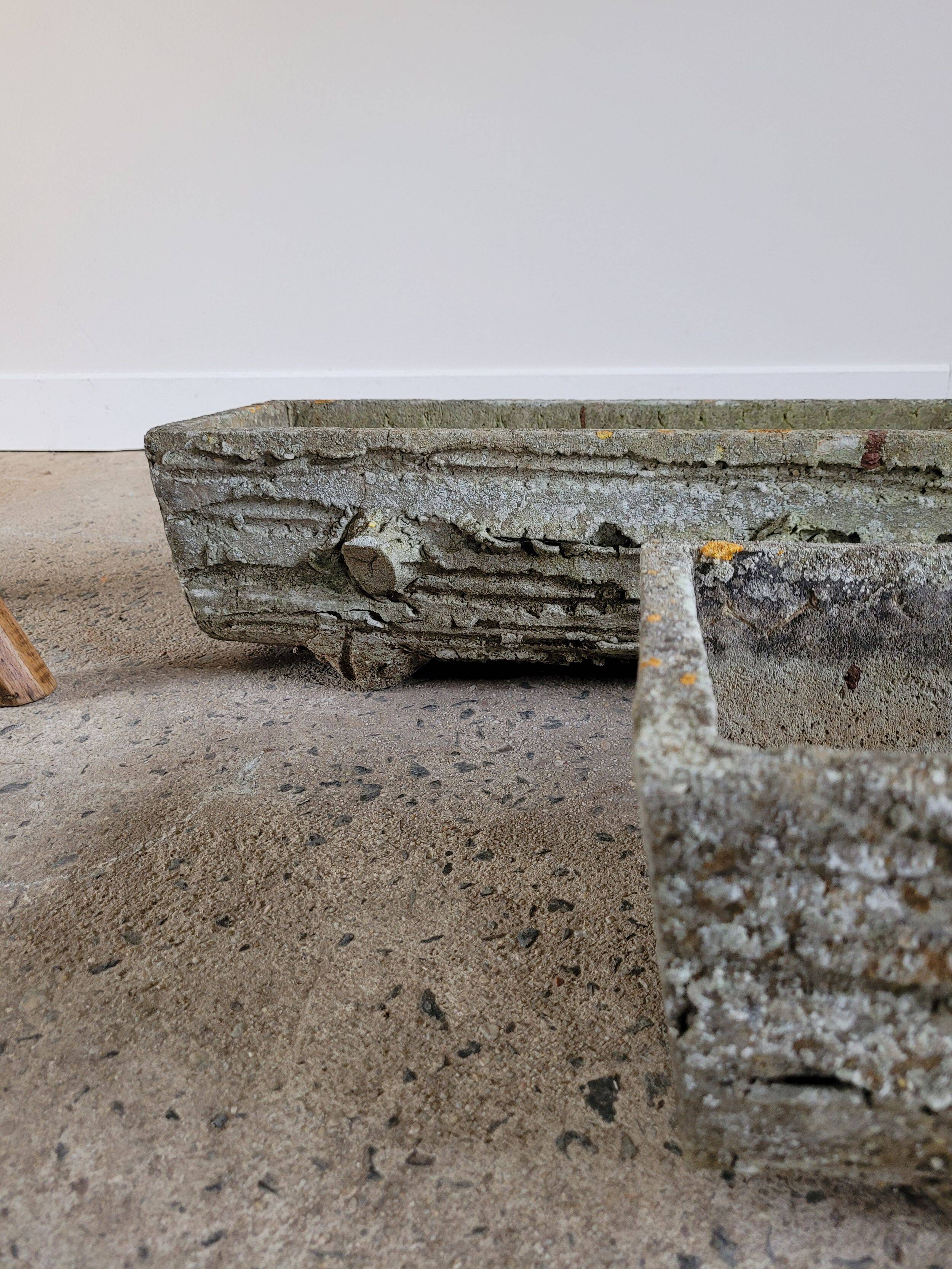 Old planters in faux cement wood