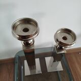Pair of designer candlesticks in chromed metal.