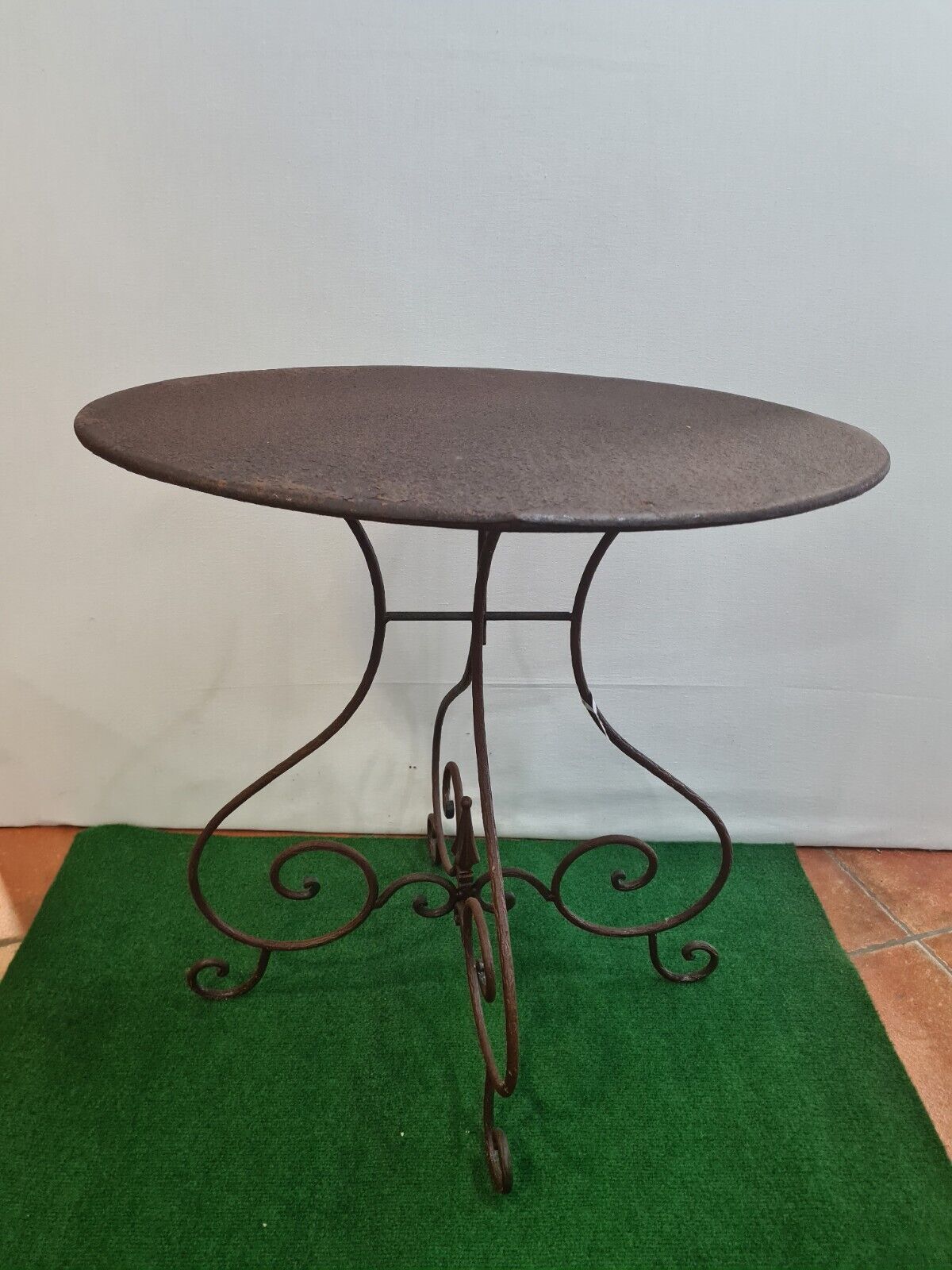 Wrought iron pedestal table