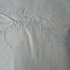 Old linen sheets embroidered with flowers