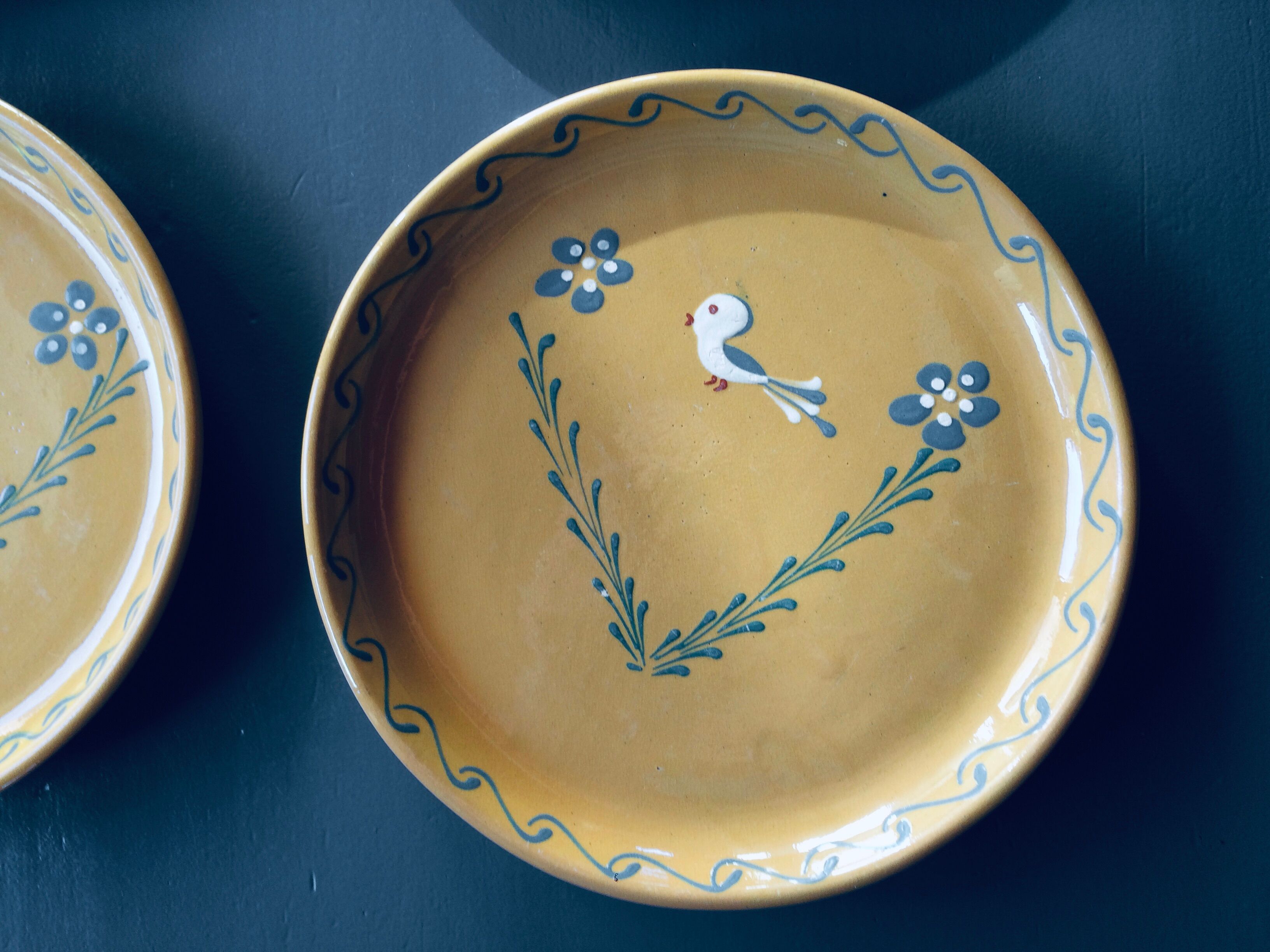 The six Piaf plates in painted terracotta