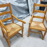 Two oak armchairs with straw seats