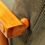 Mid-century modern design armchair in olive green corduroy.