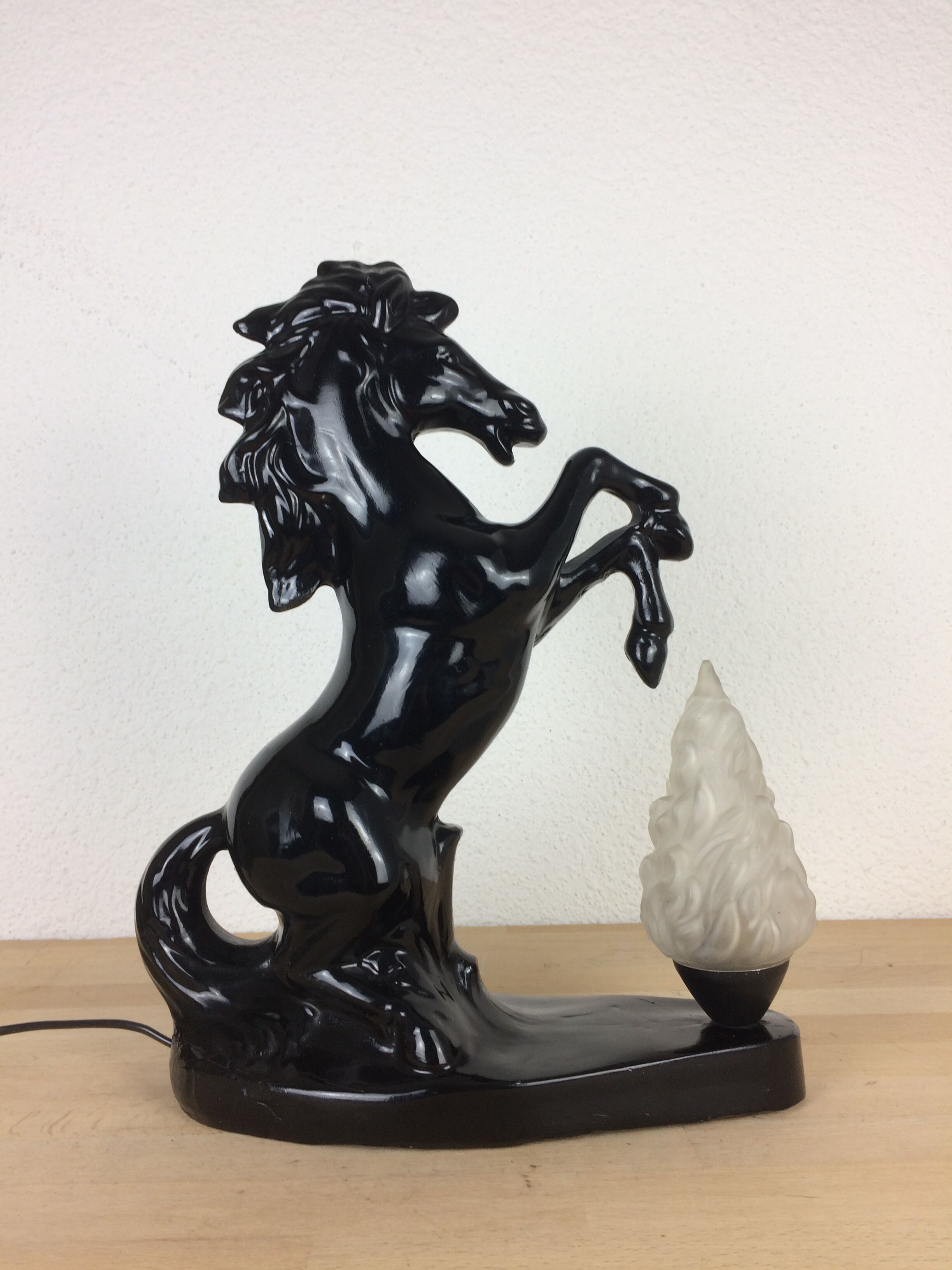 Prancing horse lamp and flame