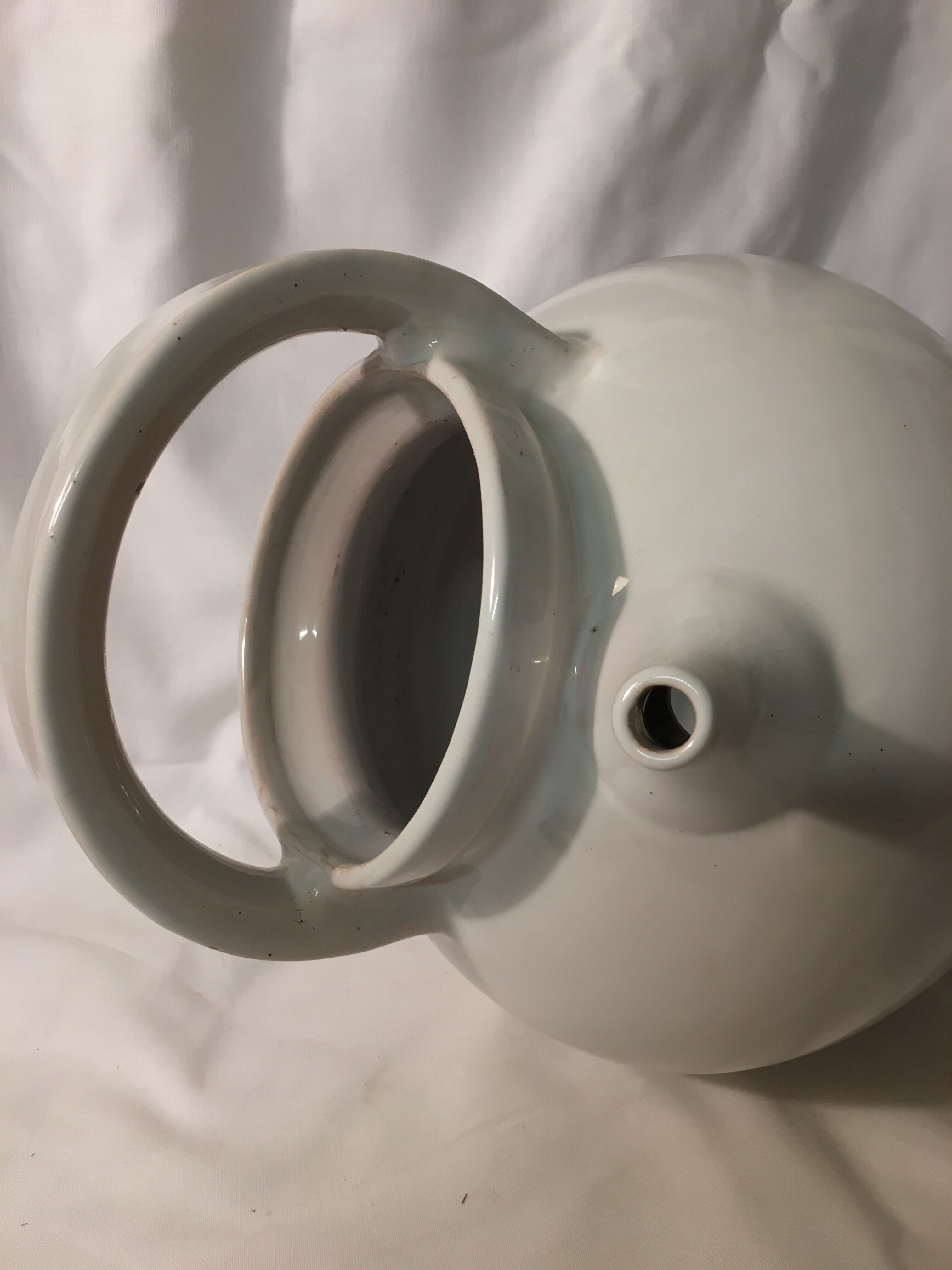 Old chevrette / pitcher in white earthenware