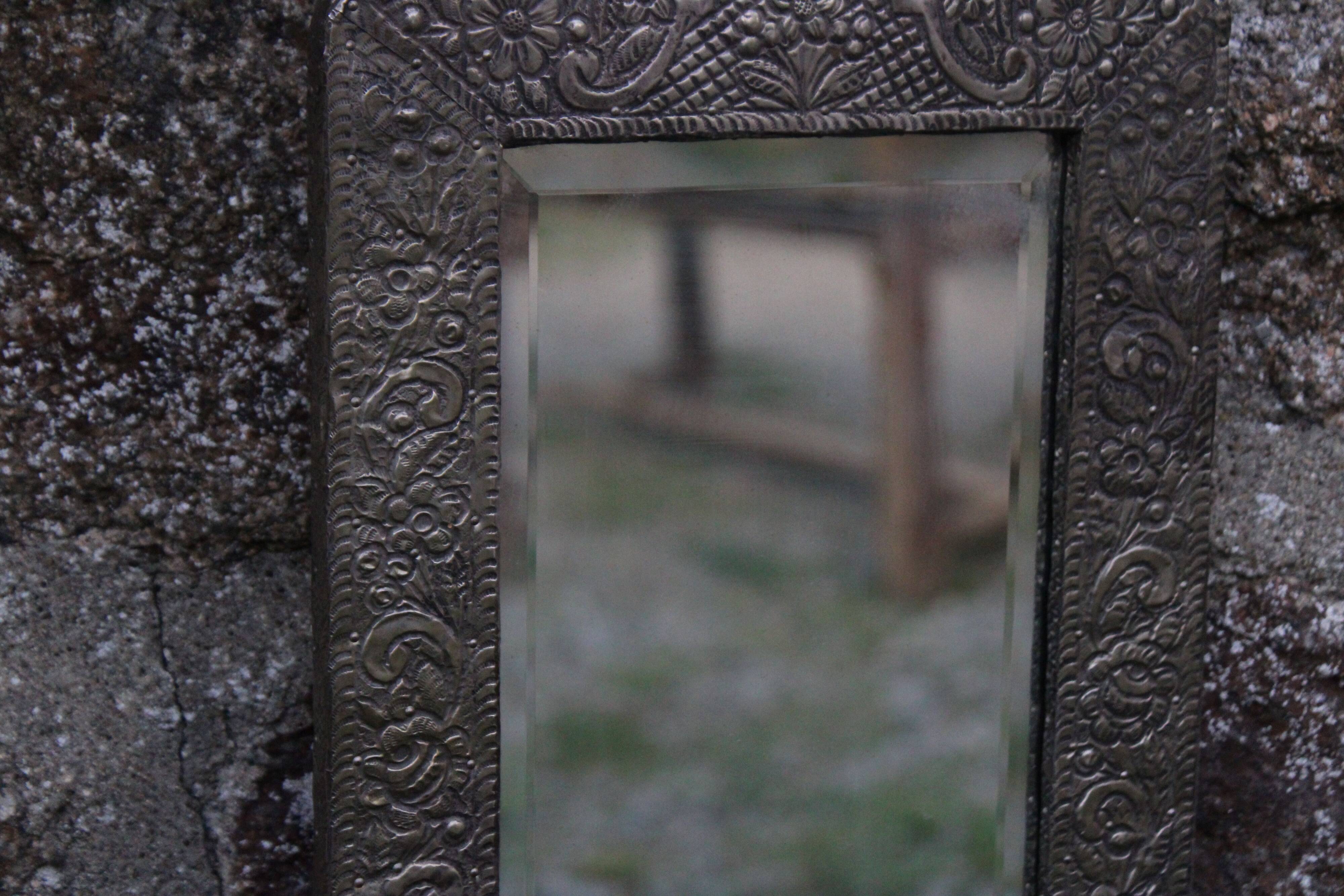 Oriental mirror in chiseled metal – beveled, for placing on a surface or hanging