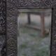 Oriental mirror in chiseled metal – beveled, for placing on a surface or hanging
