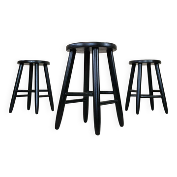 Set of three vintage stools in black lacquered wood.