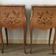 Pair of curved bedside tables in the Louis XV style with noble wood marquetry from the period.