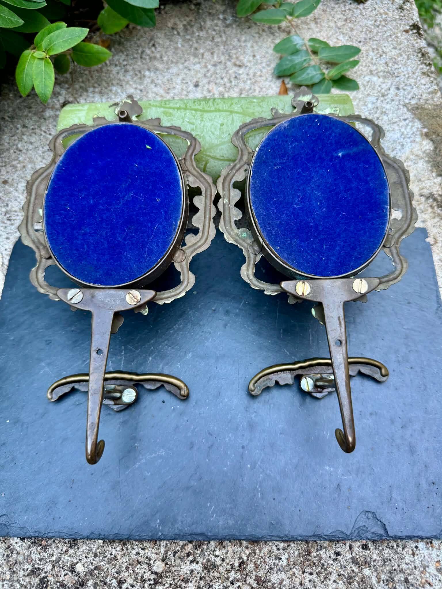 Pair of baroque brass coat hooks