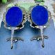 Pair of baroque brass coat hooks