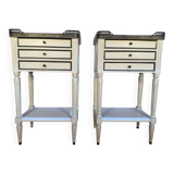 Pair of Louis XVI style bedside tables painted white.