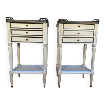 Pair of Louis XVI style bedside tables painted white.