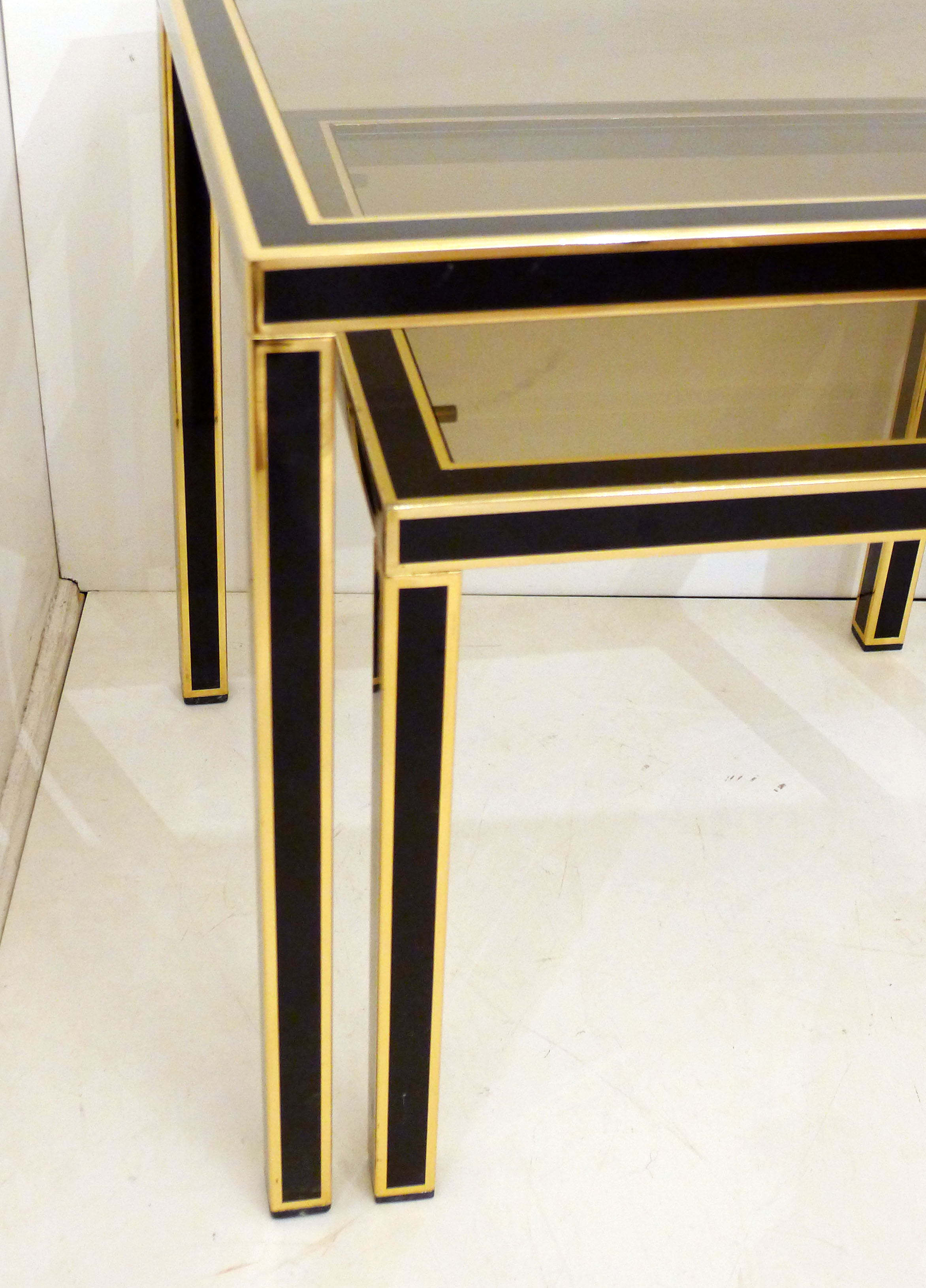 Pair of black & gold trundle tables 1970'