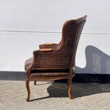 Fauteuil en rotin avec siège en cuir marron