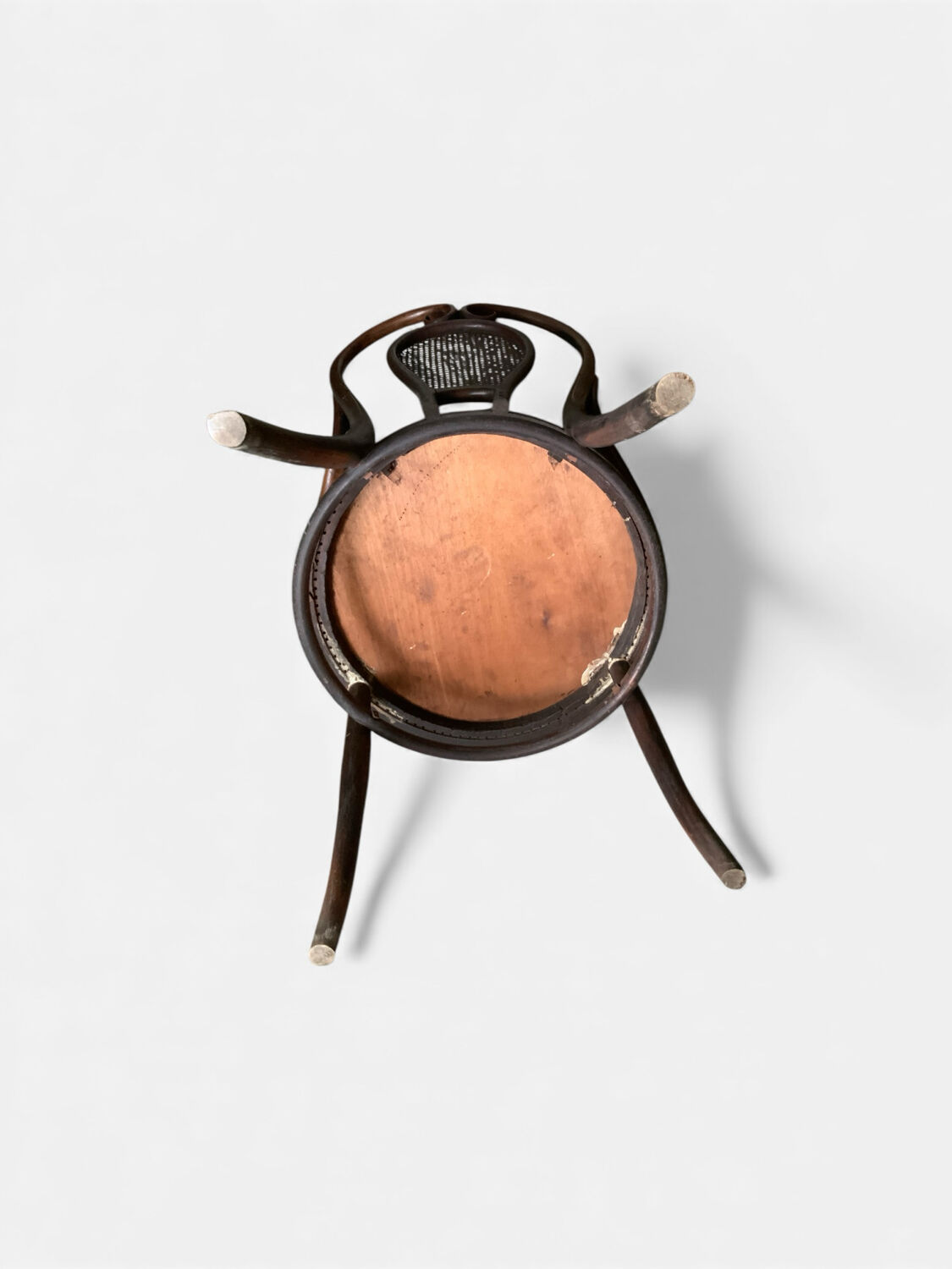 Antique curved wooden armchair with caning – Bistro style