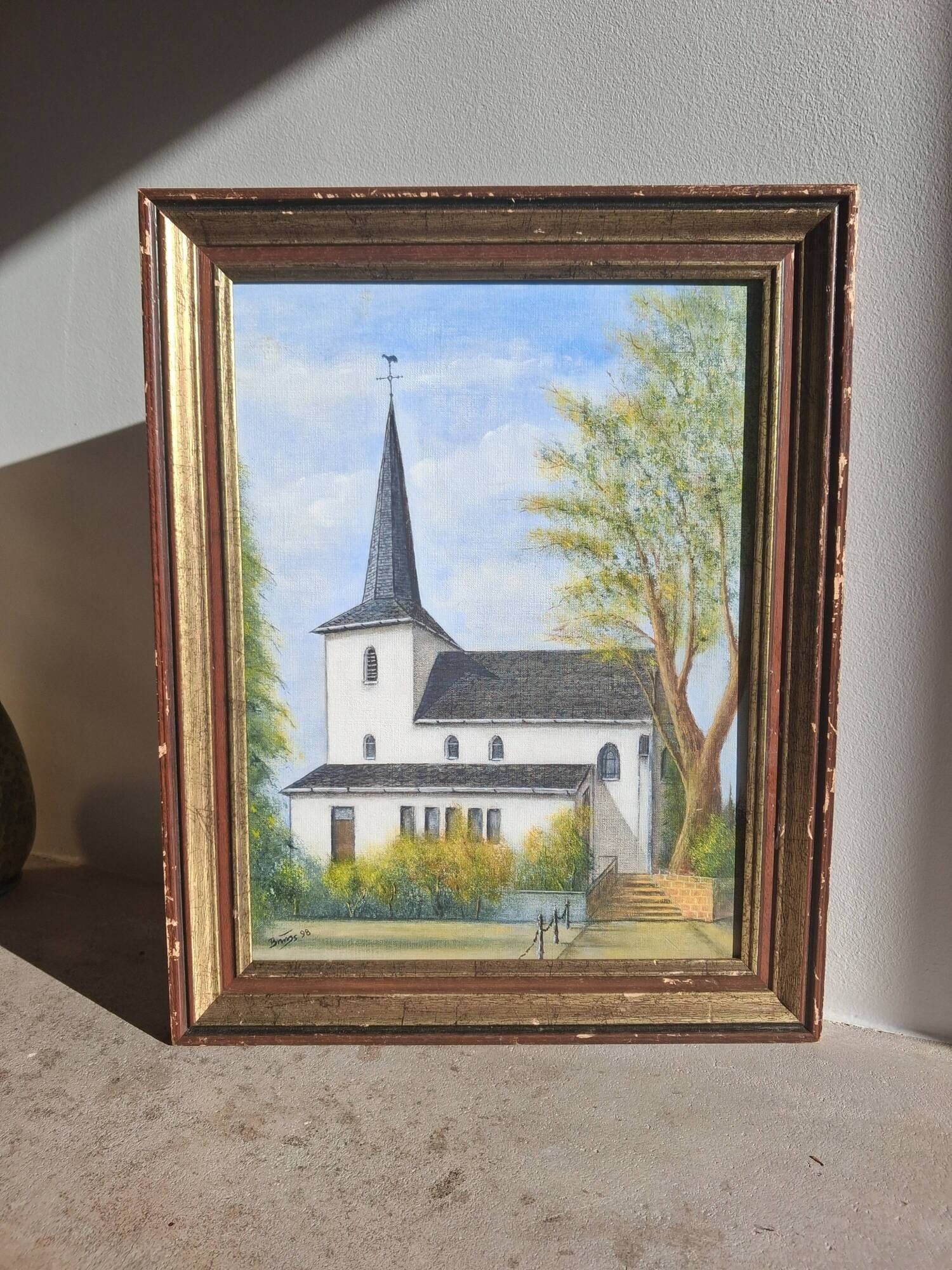 Oil on isorel depicting a church from Northern Europe.