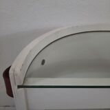 Armoire à barre vintage en forme de cylindre ouvrable, bois, laiton et verre.