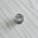 4 stainless steel egg cups.