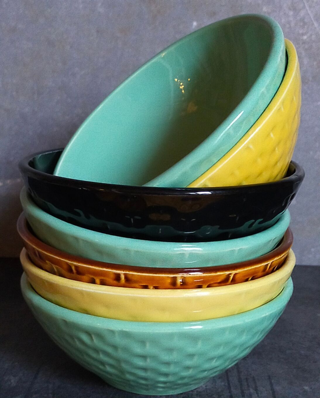 Seven vintage slip ceramic bowls