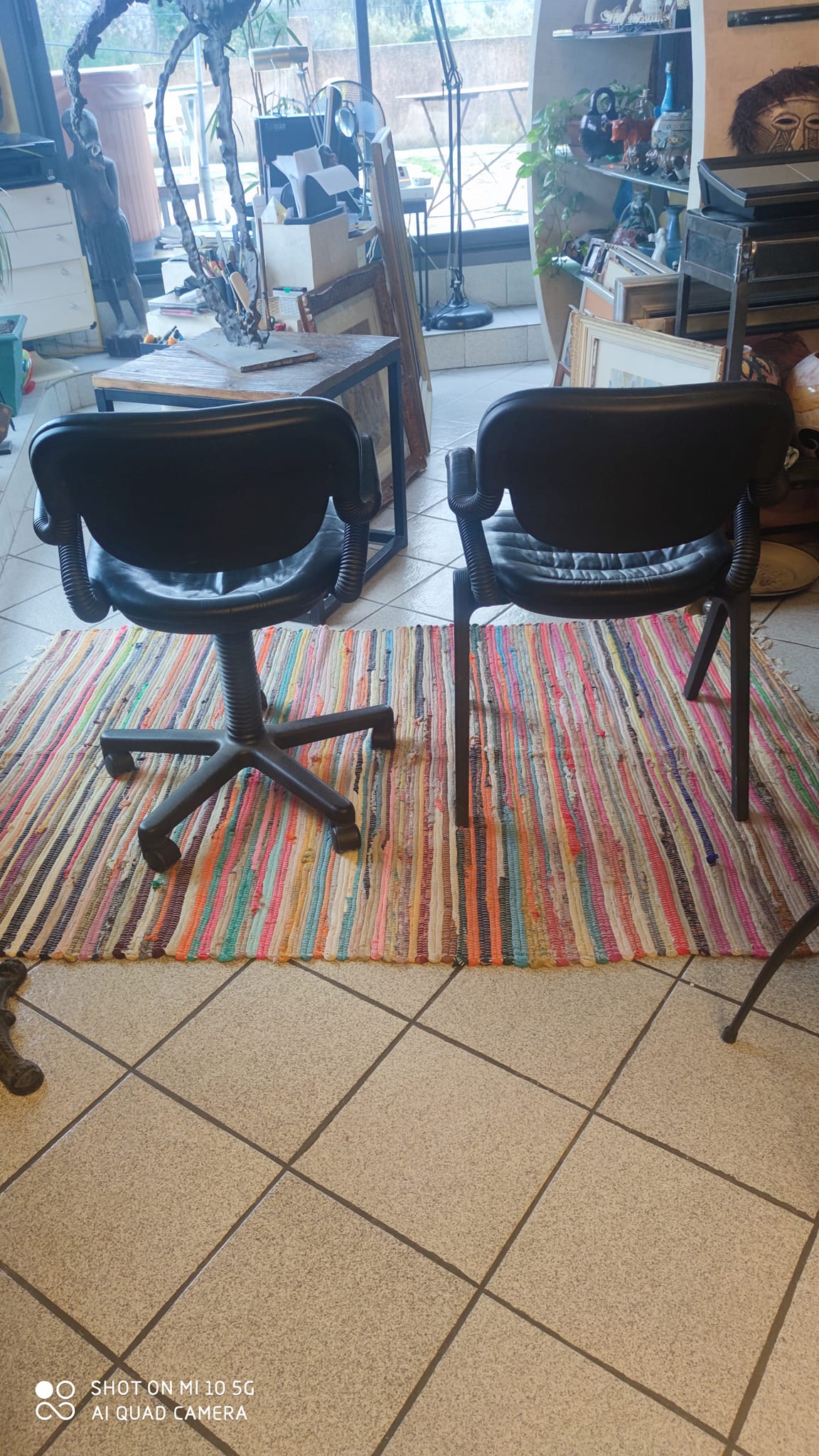 Two black leather armchairs