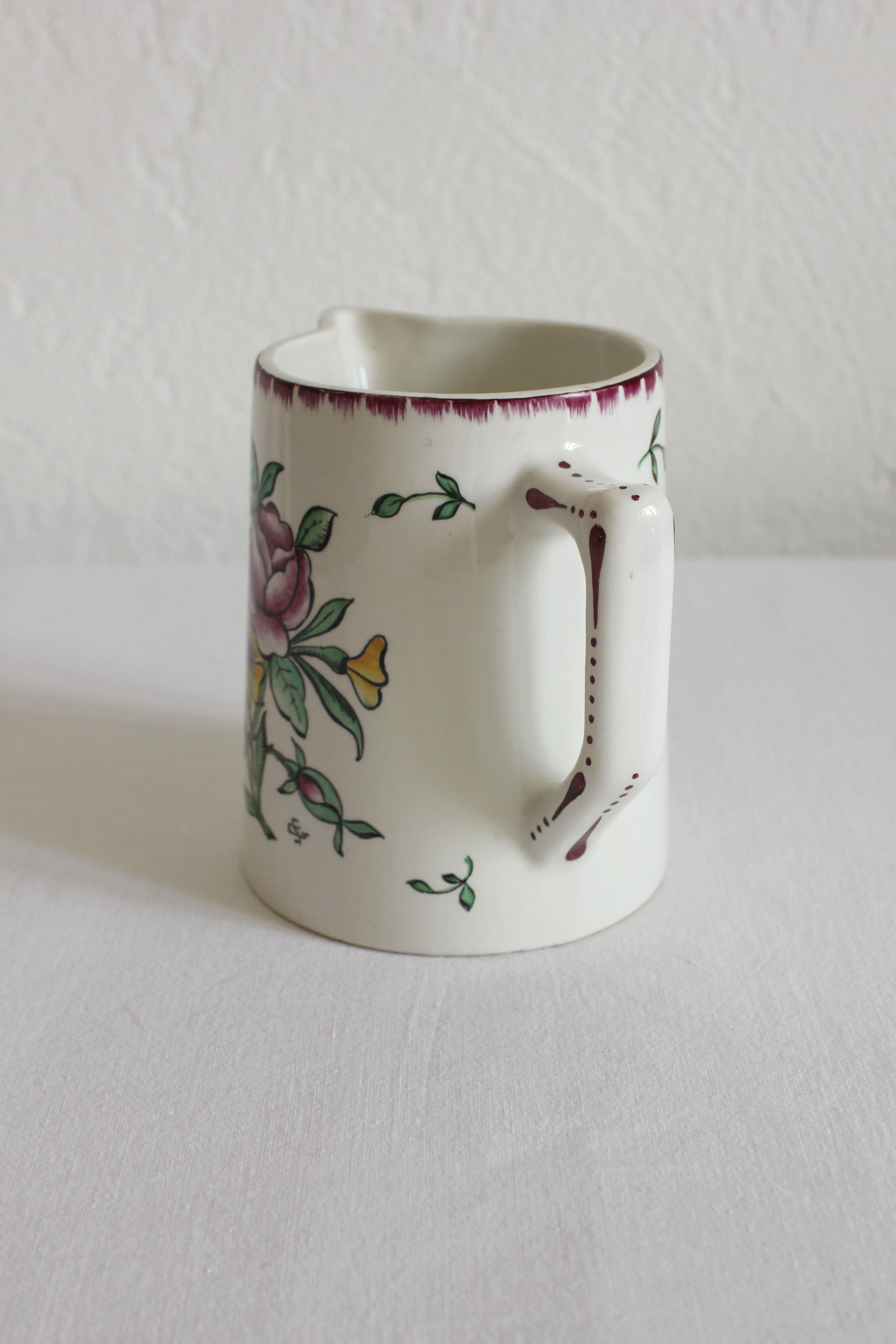 Earthenware jug with floral decoration from Digoin Sarreguemines.