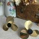 Pair of vintage brass propeller-shaped candlesticks