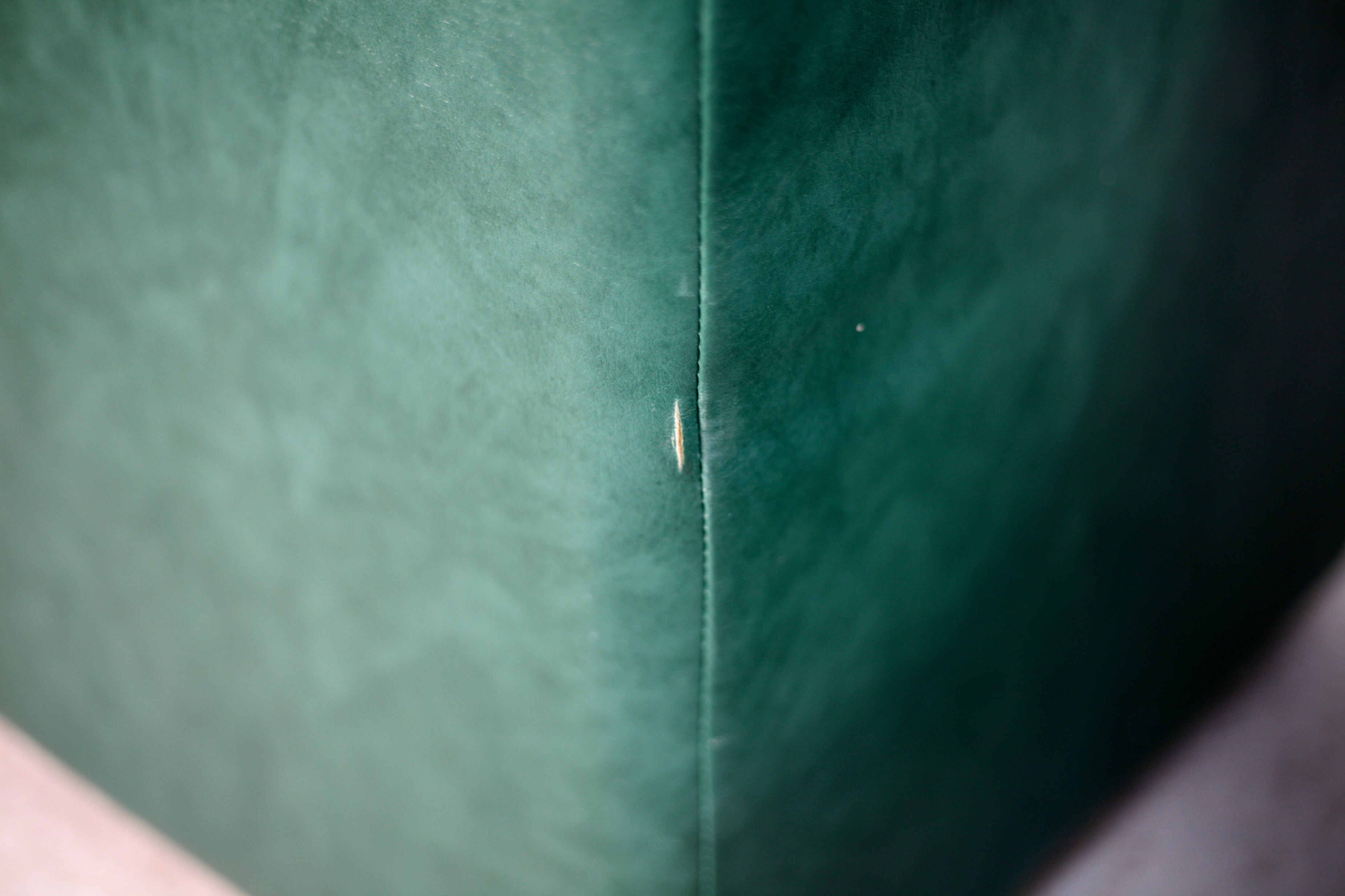 Pair of armrest heaters. Steel and green imitation leather. France, circa 1980