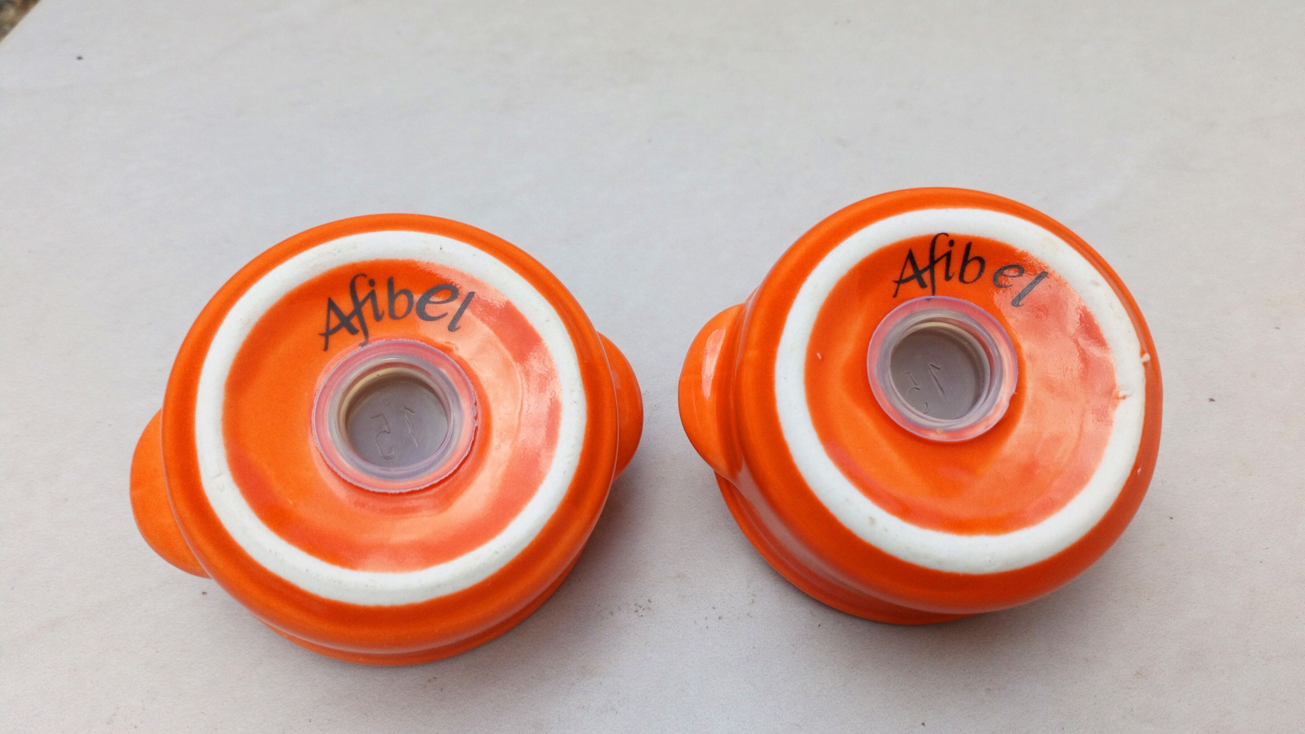 Le Creuset salt and pepper shakers