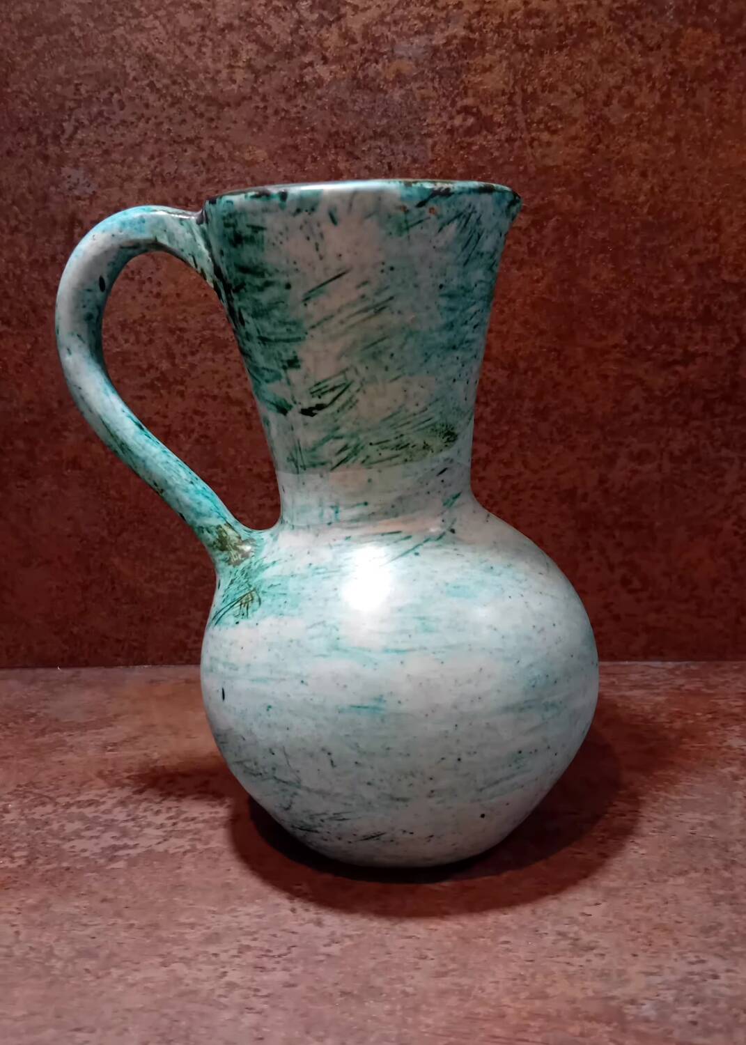 Turquoise ceramic pitcher vase