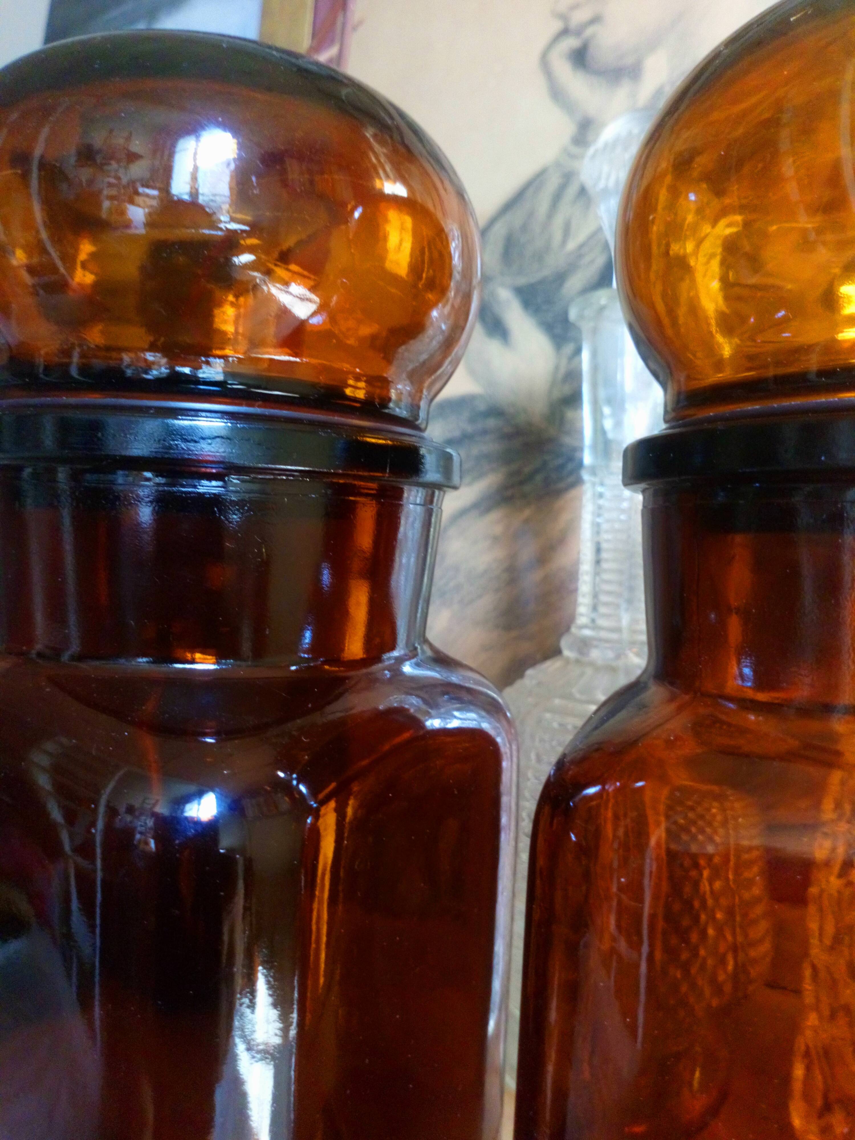 Duo of vintage apothecary bottles in amber glass