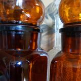 Duo of vintage apothecary bottles in amber glass