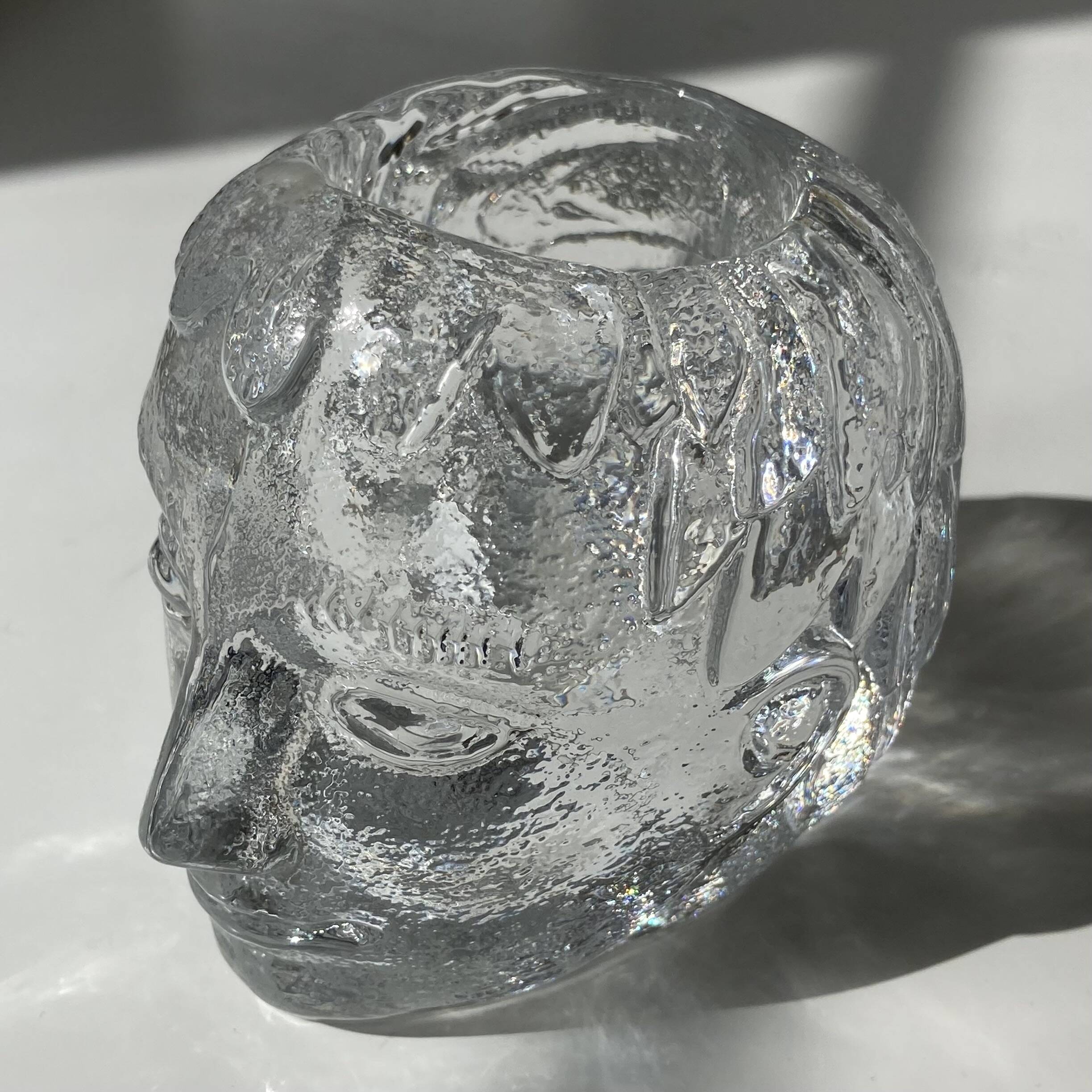 Glass candlestick by Bertil Vallien for Kosta Boda, man's head.