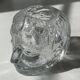 Glass candlestick by Bertil Vallien for Kosta Boda, man's head.