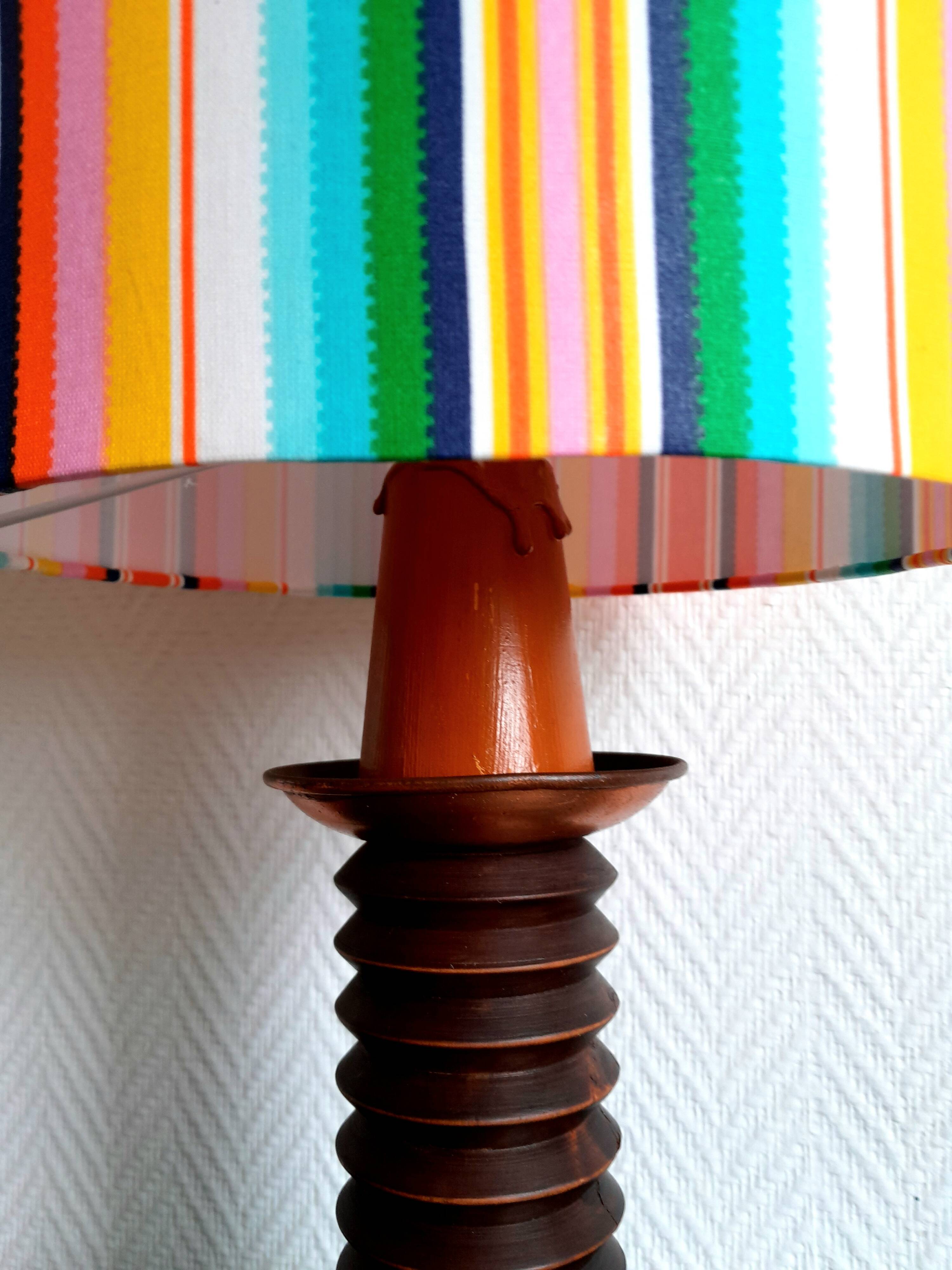 Wooden lamp with striped lampshade