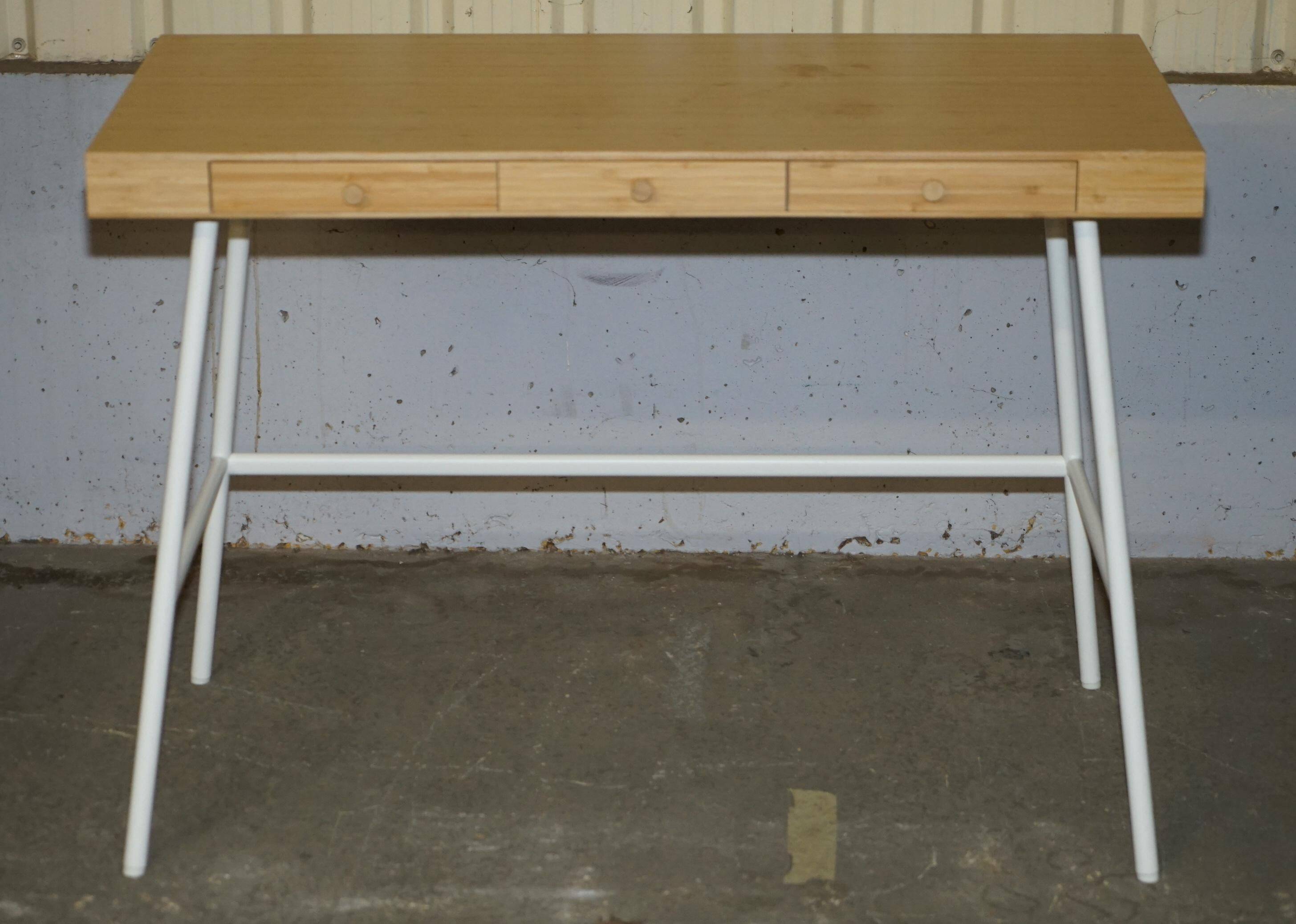 Small bamboo desk with three drawers.