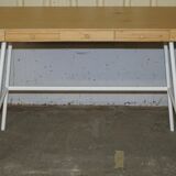 Small bamboo desk with three drawers.