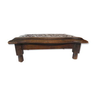 rests wooden foot carved first name Marie