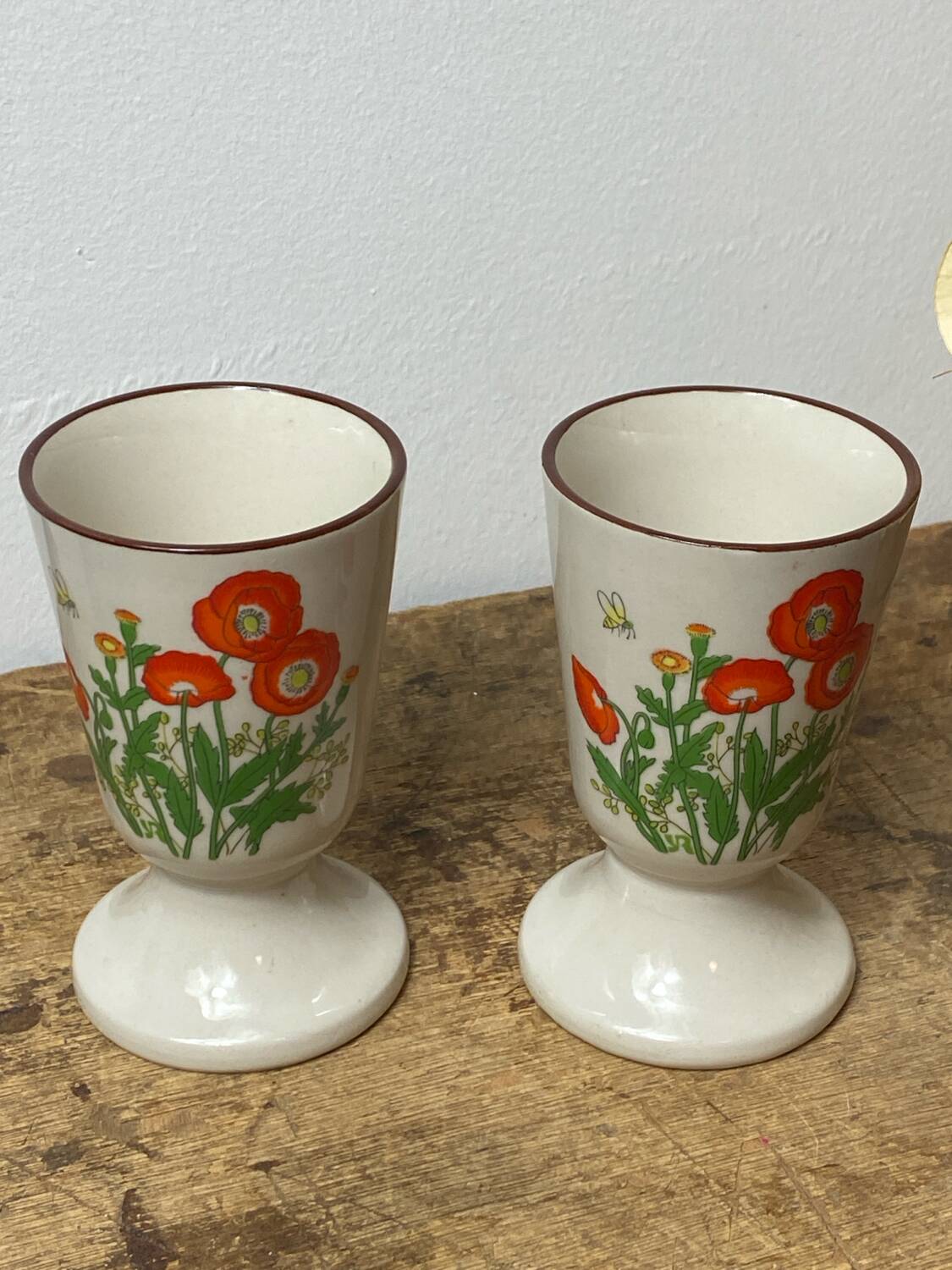 Pair of stoneware mazagrans, poppy decoration