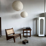 Reclined armchair in canned teak in natural wood