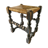 Tabouret en bois sculpté et assise paillée